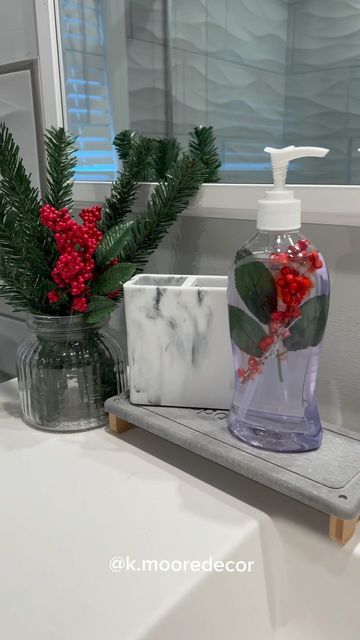 Kim | DIY | Home Decor & Inspire Decor on Instagram: "DIY Christmas soap dispenser💫 Here’s a way to add some Christmas cheer to your bathroom decor. You can customize this any way you like! I think using tinsel would be really nice too!! What do you think? Are you decorating your bathroom for Christmas? 🎄 ♥️ Follow me @k.mooredecor for Holiday and Home decor ideas 💫 : : : : : : : : #dollartree #diydollartree #bugetfriendly #dollardecor #christmasdecor #christmasdecor #christmascrafts #holly" Snowman Bathroom Ideas, Diy Christmas Soap Dispenser, Diy Christmas Bathroom Decor, Diy Christmas Soap, Christmas Bathroom Ideas, Christmas Soap Dispenser, Winter Bathroom Decor, Bathroom Christmas Decorations, Christmas Decor Bathroom