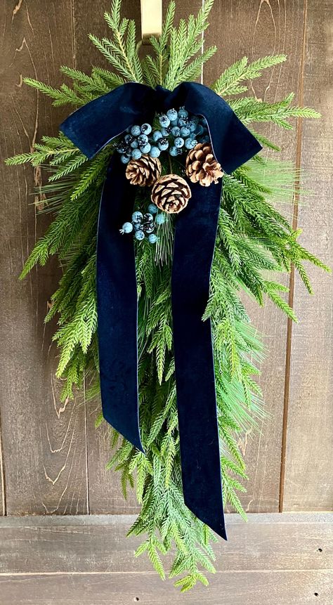 Green And Blue Christmas Decor, Winter Wreaths For Front Door Diy, Blue And Green Christmas Decor, Christmas Swags For Front Door, Pinecone Swag, Navy Wreath, Tree Installation, Pine Swag, Front Door Swag