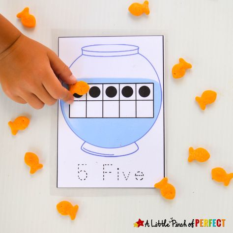 Kids can learn number recognition, counting, and subitizing while having fun with fish in a fish bowl using our free printable. Each fish bowl has a number, 10-frame chart, and written number on it that can be traced for added practice and learning. My kid’s love getting out the Goldfish crackers to go along with … Rainbow Fish Math Activities, Paper Plate Fish, Fish Activities, Mini Aquarium, Kindergarten Rocks, Fishing For Beginners, Counting Cards, Fish Crafts, Activities Preschool