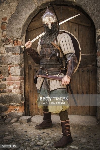 Viking warrior with helmet leather armour and gambeson sword and shield 10th century Historical reenactment Leather Armour, Viking Armor, Viking Reenactment, Historical Armor, Historical Reenactment, Leather Armor, Knight Armor, Norse Vikings, Arm Armor