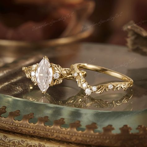 Vintage Moissanite Marquise Cut Engagement Ring Set Leaf Engraved Yellow Gold Wedding Ring Set Nature Inspired Ring Diamond Rings For Women RING DESCRIPTION ✦Engagement ring Center Stone: Moissanite Shape: Marquise shaped Size: 5x10mm Accent Stone: Natural Diamond/ Moissanite Weight: approx 0.05ct Shape: Round  Shaped ✦Band width: approx 1.6mm ✦Wedding band Stone: Natural Diamond/ Moissanite Shape: Round  Shaped Weight: approx 0.085ct ✦Band width: approx 1.6mm Total Weight: about 4.32g Metal: 14 Wedding Ring Marquise Sets, Marquise Vine Engagement Ring, Marquise Floral Engagement Ring, Nature Inspired Marquise Engagement Ring, Engagement And Wedding Ring Sets Gold, Wedding Rings Vine, Enchanted Forest Engagement Ring, Marquis Wedding Set, Marquis Wedding Ring Set