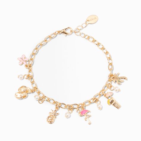 Welcome to paradise! Population you and this bracelet. The gold-tone charmer has an enamel flamingo, a flower, a pineapple, and a few faux pearls round out this tropical-infused beauty. Finish: Gold-tone Length: 6 in. + extender / 15.24 cm. + extender Closure: Lobster clasp Material: Metal - Claire's Gold Paradise Charm Bracelet Summer Charm Bracelet, Cheap Wishlist Ideas, Baby Mommy, Embroidery Crewneck, Bday List, Welcome To Paradise, Tropical Jewelry, Bracelets Collection, Daughter Bedroom