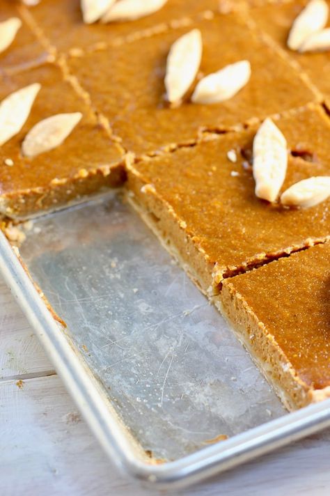 This delicious & simple sheet pan pumpkin pie is a new twist on an old classic! Cooked & served on a sheet pan, it serves a crowd of 20-24 people. #thanksgiving #pumpkinpie #slabpie #pumpkin #sheetpan #easydessert #thanksgivingdessert #dessertforacrowd Sheet Pies Thanksgiving, Pumpkin Sheet Pie Recipe, Pumpkin Pie Squares Easy, Pumpkin Pie 13x9, Sheet Pan Pumpkin Pie Recipe, Sheet Pumpkin Pie, Pumpkin Pie In A Sheet Pan, Pumpkin Pie Sheet Pan Recipe, Pumpkin Pie Sheet Cake