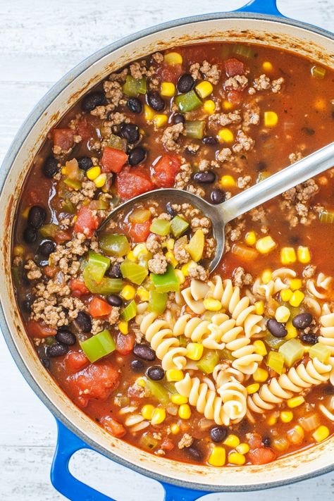 Indulge in a hearty and comforting bowl of taco soup with noodles. This delicious fusion dish combines all the flavors of classic taco soup with the added twist of tender noodles, creating a unique and satisfying meal. Whether you're craving a cozy dinner on a chilly evening or looking for a new twist on your favorite comfort food, this taco soup with noodles is sure to hit the spot. Try this easy recipe today and treat yourself to a delightful blend of spice, warmth, and comfort in every bite. Taco Soup With Noodles, Taco Spice Mix, Soup With Noodles, Spiral Pasta, Tortilla Strips, Taco Soup Recipe, Fusion Dishes, Cozy Dinner, Taco Soup