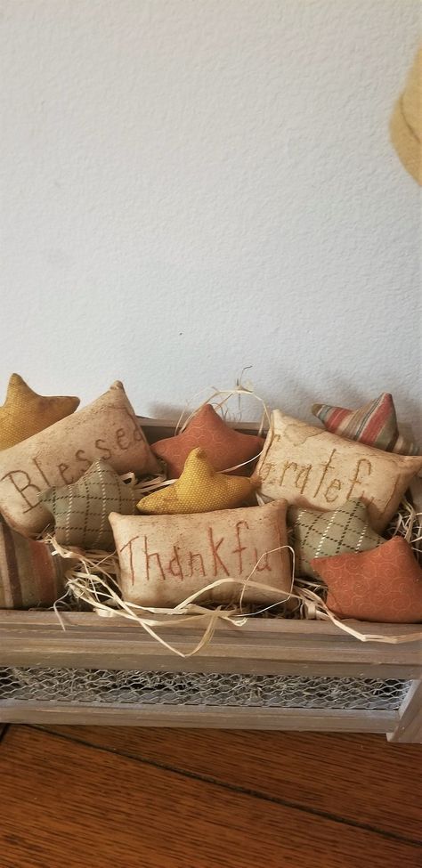 "How cute are these prim Thanksgiving bowl fillers? They have great Fall colors in the stars and muslin pillow tucks with the words, \"Thankful, Blessed, and Grateful\". Just pop them in any bowl, crate, or metal plate and have a great centerpiece for the Fall and Thanksgiving season. You will get 8 star bowl fillers, all fall fabrics. You will also get 3 muslin pillow tucks with the words, Grateful, Blessed, Thankful hand stitched in Fall colors. All the items have been hand stitched, sewn, and Bowl Filler Pillows, Winter Bowl Filler, Welding Projects Ideas Easy, Rebar Welding Projects, Diy Bowl Fillers, Thanksgiving Bowl, Fall Bowl Fillers, Muslin Pillow, Primitive Fall Decorating