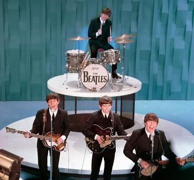 The Beatles made their U.S. television debut on the "Ed Sullivan Show" in New York on Feb. 9. 1964: From left, front, are Paul McCartney, George Harrison and John Lennon. Ringo Starr plays drums. Beatles Performing, The Beatles Ringo, Ringo Star, Beatles Ringo, Ed Sullivan Show, Ed Sullivan, Beatles Photos, The Ed Sullivan Show, Beatles Pictures