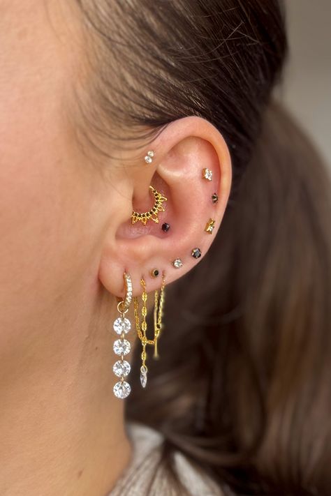 new year inspired ear stack Gold Ear Stack, Ear Stack, Cartilage Earrings, Ear Jewelry, Tattoos And Piercings, Black And Gold, Ear Piercings, Gold Earrings, Diamond Earrings