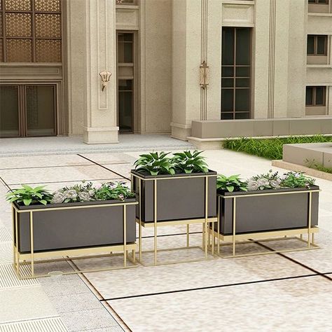 In the past few years, we've served our clients and architectural designers who are foucus on residential landscape decor and commercial landscape architecture for modern day life with quality metallic planter boxes. They like placing flowers and plants with exquisite containers for decoration in commercial areas. Beautiful and indestructible metal planters are common choices for various of real estate projects. Restaurant Planters, Planter Boxes Flowers, Entrance Tables, Planter Box Designs, Indoor Planting, Lift Lobby, Commercial Landscape, Hotel Flowers, Golden Garden