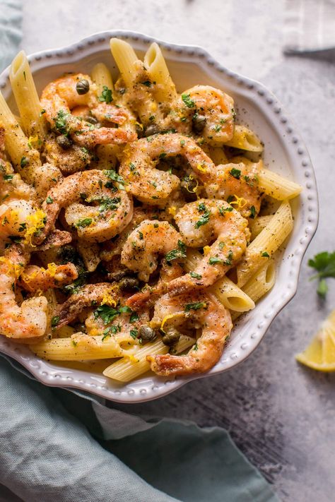 This quick and easy shrimp piccata recipe is ready in under half an hour! Succulent shrimp are cooked in a lemon-butter-caper sauce and served over penne. Dinner Ideas Seafood, Date Night Dinner Ideas, Shrimp Piccata, Lemon Shrimp Pasta, Lemon Chicken Piccata, Piccata Recipe, Chicken Piccata Recipe, Date Night Dinner, Shrimp Recipes For Dinner