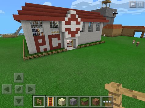 A Pokemon Center I created on Minecraft based off some pictures I saw on Google. It turned out really well. Japanese Blacksmith Minecraft, Minecraft Wagon Design, Minecraft Pokemon Builds, Minecraft Pokemon Center, Pokemon Graveyard, Minecraft Pe, Pokemon Center, Minecraft Creations, Crafting Ideas