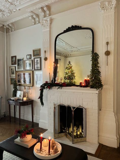 Shop my NYC apartment decor here. If you're looking for inspiration for your Christmas fireplace mantle or NYC apartment decor. #apartmentholidaydecor #mypicks #shopmylook #nycapartment #apartmentlivingroomdecor #nyc #holidaydecor #myholidaypicks Mirror Mantle Decor, Candle Sconces Living Room, Nyc Apartment Decor, Apartment Holiday Decor, Fireplace Decor Candles, Christmas Fireplace Mantle, Pinecone Candle, Fireplace Apartment, Apartment Ideas Living Room