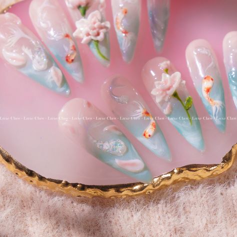 ✨ Dive into a world of tranquility with our "Ying Yang Koi Fish Lotus Harmony" nails. 🌸✨ The perfect balance of serenity, with hand-painted koi fish and delicate lotus flowers. This set brings harmony and beauty right to your fingertips! 🐟🌷 #nailart #nailsofinstagram #gelnails #nailsart #nailsoftheday #nailsnailsnails #nailtech #nails2inspire #nailinspo #longnails #summernails #pressonnails #almondnails #gelxnails #gelnailsdesign #gelnailart #trendynails #pressons #handpaintednailart #apresg... Ying Yang Koi Fish, Koi Fish Nails, Lotus Nails, Fish Nails, Nail Care Tips, Painted Nail Art, Party Nails, Stick On Nails, Bridal Nails