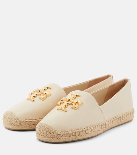 Eleanor logo leather espadrilles in white - Tory Burch | Mytheresa Raincoat Fashion, Tory Burch Espadrilles, Stylish Scarves, Leather Espadrilles, Roger Vivier, Goat Leather, Flat Espadrilles, Cream And Gold, Tory Burch Shoes