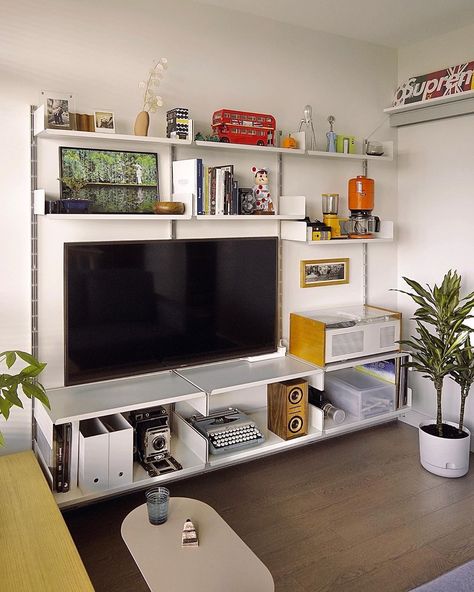 @smallspacelivebig on Instagram: “Final arrangement for the TV wall, and I’m very happy with it, and hopefully this will continue to grow in the future. My favourite part is…” Tv Surrounded By Shelves, Boaxel Ikea Tv, Tv In Studio Apartment, Tv On Shelf On Wall, Tv In A Small Bedroom, Vitsoe Tv Wall, Tv Small Apartment, Tv Bookcase Wall Small Spaces, Tv Open Shelving