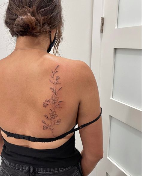 Delicate Floral Spine Tattoo, Palm Tree Tattoo Side Ribs, Lilly Spine Tattoo, Flower Back Tattoo Women, Red Floral Tattoo, Floral Collar Bone Tattoo, Lyric Tattoos Placement, Wildflower Spine Tattoo, Simple Back Tattoo Women