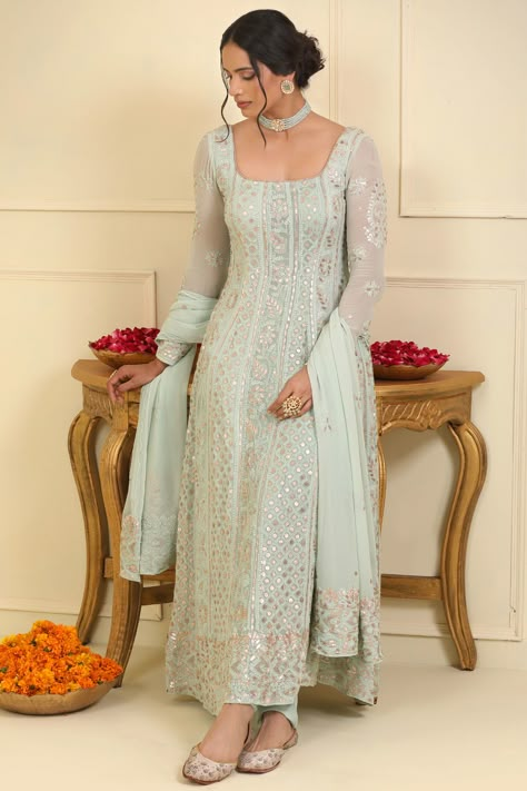 Featuring an ice blue chikankari anarkali in georgette base with sequins and gota embellishments. It is paired with matching semi crepe pants and a dupatta having sequins and gota embellishments.The biggest luxury blowout end of season sale up to 50% off Anarkalis to Adore. #Perniaspopupshop #womenswear #ethnic #whatiworewastrending #ppuslove #anarkaliset #chikankari #georgette #sequins #semicrepe #gotaembroidery #weddingwear #festivewear #sangeet #weddingceremony Square Neck Anarkali, Anarkali Kurti Design, Simple Anarkali Suits, Chikankari Anarkali, Anarkali Designs, Pink Anarkali, Long Frock Designs, Chikankari Suits, Frock Designs