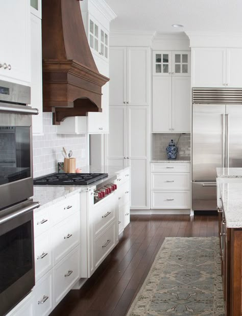 White Kitchen with Stained Wood Hood. White Kitchen with Stained Walnut Wood Hood Ideas. White Kitchen with Stained Wood Hood. White Kitchen with Stained Wood Hood #WhiteKitchen #StainedWoodHood #WoodHood #walnut #walnutkitchen Bria Hammel Interiors New Classic Interior Design, New Classic Interior, Hampton Style Kitchen, Interior Ikea, Hood Ideas, Painted Kitchen Cabinets Colors, Rustic Kitchen Cabinets, Kitchen Hood, Farmhouse Kitchen Design