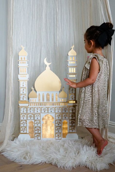 Days of Eidis introducing the Ramadan Countdown Calendar also known as a Ramadan Advent Calendar to make Ramadan more interactive with your little onesIn the shape of a masjid with two beautiful minaretsthis wooden Ramadan Countdown Calendar is the only one on the market that lights upOur Days of EidRamadan Countdown Calendar contains LED lights which give it a more realistic feel and is powered by two AA batteriesA Ramadan activity printable for each day is available on the websiteOrder your R Eid Outfits For Teens, Ramadan Countdown Calendar, Ramadan Advent Calendar, Ramadan Diy, Ramadan Countdown, Eid Ideas, Wooden Castle, Eid Decor, Iftar Party