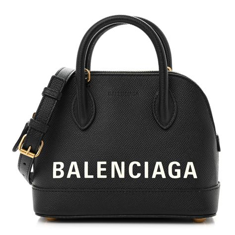 This is an authentic BALENCIAGA Grained Calfskin XXS Ville Top Handle Bag in Black. This fine handbag is crafted of grained calfskin leather in black with Balenciaga written in white on the front. The bag features rolled top handles and an optional leather shoulder strap. The wrap-around zipper opens to black leather and fabric interior with pockets. Handle Bag, Top Handle, Calf Skin, Balenciaga, Top Handle Bag, Shoulder Strap, Black Leather, Handles, Black White