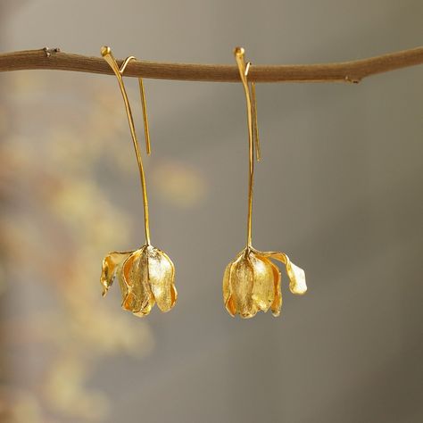 "Our specially handcrafted tulip drop earrings are suitable for nature lovers.  The tulip was popularized by Van Gogh, Monet, and Rembrandt. Tulip is regarded as a symbol of victory and beauty. At the same time, it also represents the expression of love and eternal blessing. You can wear it to Keukenhof Park in the Netherlands to enjoy tulip fields of that precious land. Tulips are loved for their simplicity, grace, and elegance and that is where we draw the simplicity of this piece from. For th Tulip Jewelry, Floral Earring, Tulip Earrings, Flower Earrings Gold, Bridal Earring, Crochet Collection, Earring Wedding, Flower Earring, Spring Earrings