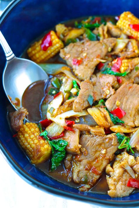 This Thai Basil Pork Stir-fry is exploding with garlicky chili and peppery holy basil flavors, and super easy to stir-fry in under 30 minutes on any given weeknight! This version is made with tender pork collar meat and is extra saucy, and it is incredibly DELICIOUS with a bowl of steamed rice! #thaibasilpork #thaifood #asianfood #dinner #stirfry #holybasil #weeknight | That Spicy Chick Pork Collar, Thai Basil Pork, Basil Pork, Pork Stir Fry, Thai Basil, Holy Basil, Steamed Rice, Savory Recipes, Thai Recipes