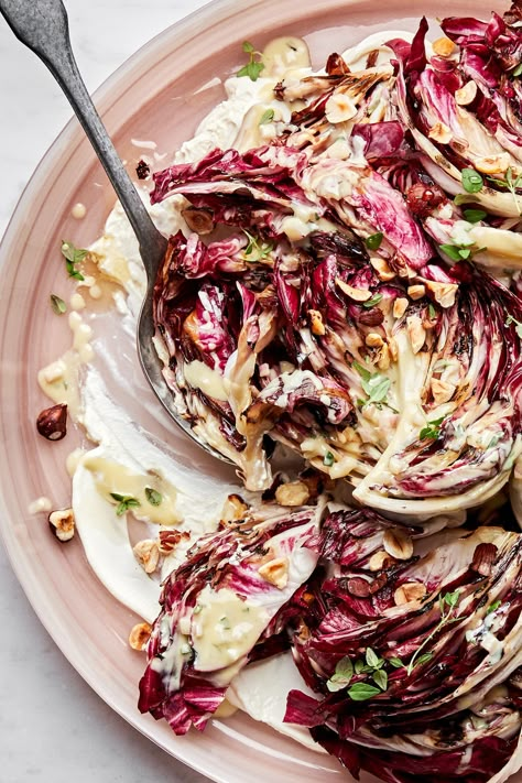 Once radicchio is grilled and dressed with a crème fraîche vinaigrette, it’s really amazing. This wintertime salad is full of crispy charred edges and a tangy creamy dressing. Celery Root Salad Recipes, Lolo Rosso Salad, Grilled Radicchio Recipes, Endive And Radicchio Salad, Vegan Radicchio Recipes, Easy Romaine Salad Recipes, Porchetta Sides, Raddichio Recipes Salad, Crème Fraiche Recipes