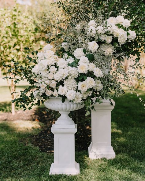 An elegant classic ceremony set-up at Rosemont, featuring stunning urn florals overflowing with roses, hydrangeas, and delphinium. A floral runner seamlessly connects the urns, creating the illusion of a floral arbor 🍃🍃🍃  @weddingsofdesire @rosemont_weddings_events @danellebohane @nataliedrumcelebrant #bridetobe2024 #flowersstgermain #weddingflorist #springwedding #classicbride #melbourneflorist #romanticwedding #melbournewedding #outdoorceremony #europeaninspired #europe #gardenwedding ... Floral Arches Wedding, White Hydrangeas Wedding, Classic Wedding Centerpieces, Florist Inspiration, Bordeaux Wedding, White Hydrangea Wedding, Floral Arbor, White Wedding Ceremony, Ceremony Florals