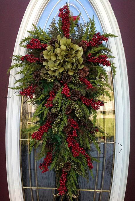 Christmas decorations need not be difficult: a decadent ribbon tied around a door knob with a sprig of holly. Teardrop Swag, Winter Wreaths, Christmas Church, Door Swag, Christmas Decorations Wreaths, Colonial Christmas, Navidad Diy, Wreath Decoration, Christmas Swags