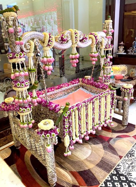 Beautiful Cradle decor for a Cradle Ceremony. #cradleceremony #cradledecor #floraldecor #indiandecor #traditionaldecor Namakaranam Decoration, Uyyala Function, Cradle Ceremony Decorations, Photoshop Glow, Cradle Decoration, Indian Baby Shower Decorations, Naming Ceremony Decoration, Baby Naming Ceremony, Indian Baby Showers