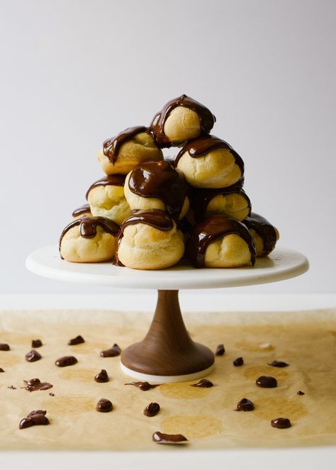 These tiramisu cream puffs are bite-sized profiteroles filled with a mascarpone and coffee whipped cream. Each puff is topped with thick dark chocolate ganache. Perfect option for a fancy finger food! Tiramisu Cream, Coffee Whipped Cream, Ganache Glaze, Chocolate Ganache Glaze, Finger Food Desserts, Flavored Liquor, Recipes With Whipping Cream, Cake Mug, Macaron Cookies