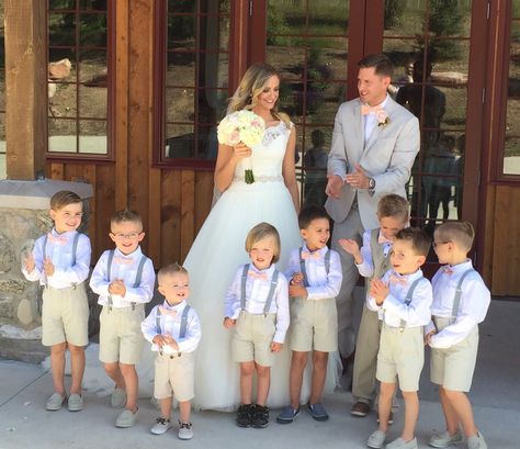 Junior groomsmen in pink bow ties. Groomsmen Attire Tan Pants, Groomsmen Attire Khaki Pants, Tan Suit Ring Bearer, Tan Country Groomsmen Attire, Tan Groomsmen Suits With Pink Bridesmaids, Concrete Wedding, Greek Islands Wedding, Wedding Outfit For Boys, Junior Groomsmen