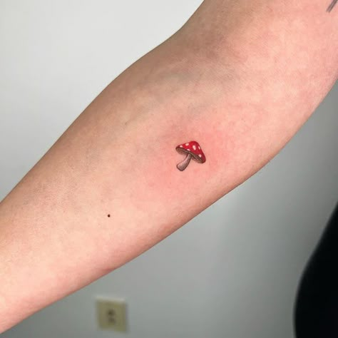 Small Mushroom Tattoo Toadstool Mushroom Tattoo, Mushroom Tattoo Behind Ear, Hand Poke Tattoo Ideas, Simple But Cool Tattoos, Mushroom Minimalist Tattoo, Micro Mushroom Tattoo, Minimalistic Mushroom Tattoo, Tiny Color Tattoos, Tattoo Ideas Mushroom Simple