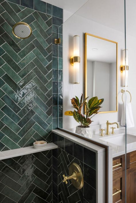 Custom shower design in this luxurious primary bathroom remodeling project. Gorgeous green tile in a herringbone pattern. Warm maple stained vanity, soft gray quartz countertop, and beautiful brass tones in the medicine cabinet, sconces, fixtures, hardware & accessories! Emerald And White Bathroom, Green Tile Primary Bath, Green And Gold Ensuite, Emerald Green And Brass Bathroom, Emerald Green Master Bath, Emerald And Black Bathroom, Dark Green Herringbone Tiles, Modern Green Tile Bathroom, Dark Green Herringbone Tiles Bathroom