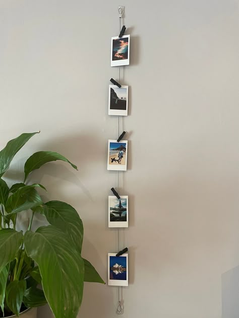 Vertical Cable Photo Display // Wire Photo Hanger // Polaroid Prints // Multiple Picture Display Standard length is 85cm but if you want a custom length then please order and add you desired length in the personalised message option. Vertical photo display with 5 black wooden pegs to hold photos/ Instax mini polaroids or mementos, A beautiful gift for yourself or a loved one. Everything required for quick and easy fitting. The discreet clear mounts blend in with your decor, and remove without da Instax Wall, Polaroid Wall Art, Polaroid Pictures Display, Polaroid Wall Decor, Hanging Multiple Pictures, Wire Photo Holder, Polaroid Display, Polaroid Wall, Photo To Art