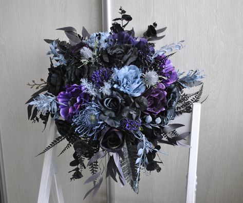 This beautiful black purple bridal bouquet is perfect for your Gothic wedding,Fall wedding,Dark purple wedding,Halloween wedding. Goth wedding bouquet available in size:bridal bouquet13'',bridesmaid bouquet 9'',toss bouquet 4''. Mixtre of silk flowers fall bridal bouquet ,dark fall bouquet in black,purple and dusty blue. Handtle tied with velvet ribbon. Is made of high quality artificial flowers and greenery. The colors may slighty daffer due to your screen settings. Witchy Bouquet Wedding, Purple And Black Bridesmaid Dresses, Blue And Purple Gothic Wedding, Black And Purple Wedding Theme Receptions, Lavender And Dark Blue Wedding, Black And Purple Flowers Bouquets, Purple Black And Blue Wedding, Dark Blue Wedding Colors, Blue Purple Black Wedding Theme