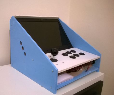 Hi All,Here is a bartop arcade cabinet I created in a weekend for under £50 (plus a tired old laptop). Retropie Arcade, Video Game Cabinet, Pi Arcade, Arcade Bartop, Arcade Controller, Diy Arcade Cabinet, Diy Video Game, Arcade Table, Old Laptop