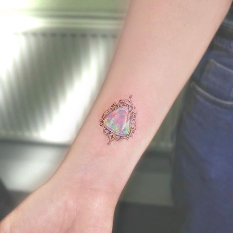 •𝟛𝟛•Currently in🇬🇧based in 🇭🇰 (@33.tattoo) posted on Instagram: “Opal Gemstone 💎 I’m in love with all types of gem stones especially Opal which captured a milky rainbow inside 🌈 Looking forward to do more…” • Dec 3, 2020 at 11:26am UTC Opal Tattoo, Colored Tattoo, Stone Tattoo, Gem Tattoo, Jewel Tattoo, Crystal Tattoo, Ankle Tattoos For Women, Sternum Tattoo, Tattoo Bracelet