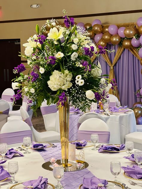 Purple And Gold Table Setting Ideas, Lilac And Gold Quinceanera Centerpieces, Purple And Gold Party Centerpieces, Purple Theme Quincenera Tables, Charro Quince Decorations, Purple And Green Wedding Decorations Table Centerpieces, Purple Theme Center Pieces, Floral Bridal Shower Decorations, Wedding Table Decorations Elegant