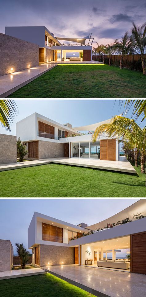 This modern beach house has a stone walkway that brings you to the front of the home where you can enter through the front door or the sliding patio doors. The patio can be enclosed by glass doors, and for extra security when the home owners are away and to protect the interior from the sun, wood brise-soleils covers slide over the glass doors. Beach House Aesthetic, Beachfront House, Stone Walkway, Door Design Modern, House Front Door, Modern Beach House, Beach House Interior, Modern Beach, Front Door Design