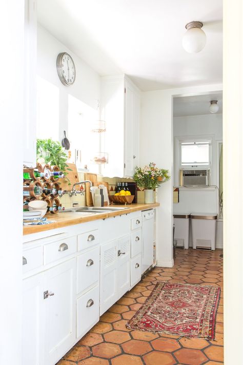 House Tour: A "Boho Beach Bungalow" in California | Apartment Therapy Saltillo Tile Kitchen, Orange Floor, Spanish Kitchen, Bungalow Kitchen, Saltillo Tile, Boho Kitchen, Beach Bungalows, Beach Boho, Kitchen Tile