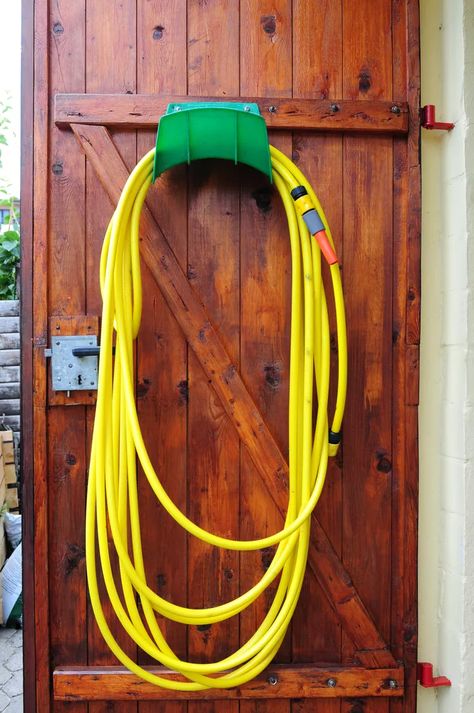 Outdoor Hose Storage Ideas, Garden Hose Storage Ideas, Hose Storage Ideas, Garden Hose Hanger, Garden Hose Storage, Hose Hanger, Beautiful Landscaping, Outdoor Cabinet, Hose Storage