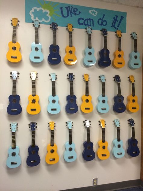 My Classroom Ukulele Storage- hung on the wall with tool hooks purchased from the hardware store. I painted the sign above to match my colors. Ukulele Storage, Teaching Ukulele, Music Classroom Organization, Music Room Organization, Music Classroom Decor, Tool Hooks, Middle School Music, Elementary Music Lessons, Elementary Music Teacher