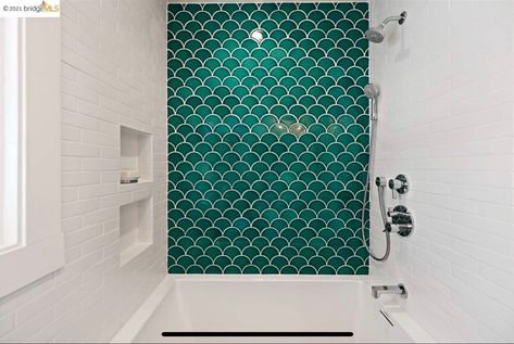 Modern bathroom with white subway tile, green fish scale tile accent Fishtail Tiles Bathroom, Fish Scale Tiles Bathroom, Fish Scale Bathroom, Fish Scale Shower Tile, Bathroom With White Subway Tile, Bathroom Fish Scale Tile, Marble Fish Scale Tile Bathroom, Green Fish Scale Tile Bathroom, Fish Scale Tile Bathroom