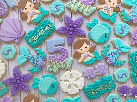 Mermaid themed cookies for brooklyn’s 5th birthday! #mermaidcookies #mermaid #undertheseaparty #underthesea #seashells #fish #customcookies… Mermaid Cookies, Mermaid Birthday Party Decorations, Mermaid Theme Birthday Party, Mermaid Birthday Cakes, 5th Birthday Party Ideas, Themed Cookies, Mermaid Theme Party, Sugar Cookie Designs, Birthday Party Theme Decorations