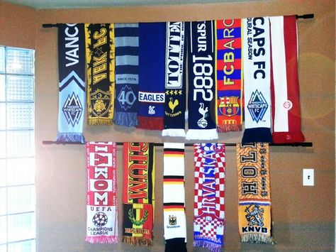 Soccer (football) sport scarf wall display diy with curtain rod Scarf On Wall Decor, Football Scarves Display, Sports Game Room Decor, Rally Towel Display Ideas, Soccer Scarf Display Ideas, Football Scarf Display, Soccer Scarf Display, Diy Soccer Decor, Scarf Wall