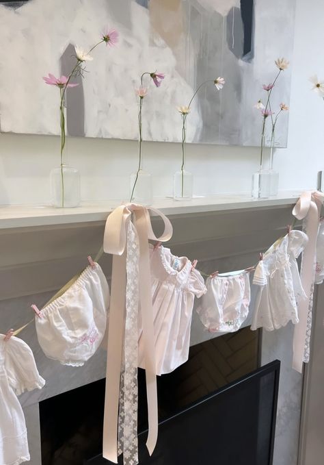 Baby Clothes Garland, Feminine Baby Shower Ideas, Baby Shower Fireplace Decor, Baby Shower Mantle Decor, Baby Shower Clothes Line, Nesting Party, Baby Shower Clothesline, January Baby Shower, Baby Tea Party