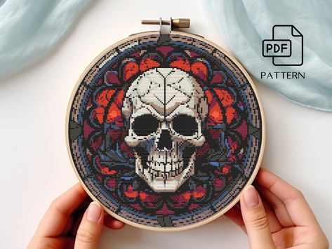 "💀🌑 Small and Easy Stained Glass Gothic Skull Cross Stitch Pattern PDF - Craft Elegant Darkness with Ease 🌑💀 Design size: 143 x 146 stitches 10-1/4 inches (25.9cm) wide 10-1/2 inches (26.5cm) high Fabric Count 14 Aida For this design you will need 12 DMC Colors Infuse a touch of gothic elegance into your stitching with our \"Small and Easy Stained Glass Gothic Skull Cross Stitch Pattern\" PDF. This mesmerizing design invites you to embark on a stitching adventure that captures the mystique of stained glass, featuring a gothic skull in all its dark and intricate glory. 🌟 Why Choose Our Small and Easy Stained Glass Gothic Skull Cross Stitch Pattern PDF? 🌟 💀🦇 Elegant Gothic Aesthetic: Our pattern showcases a captivating gothic skull inspired by stained glass art, bringing an air of da Dark Academia Cross Stitch, Gothic Cross Stitch Patterns, Goth Cross Stitch Pattern Free, Skeleton Cross Stitch Pattern Free, Creepy Cross Stitch Pattern, Goth Cross Stitch, Free Skull Cross Stitch Pattern, Stained Glass Skull, Cross Stitch Gothic Pattern