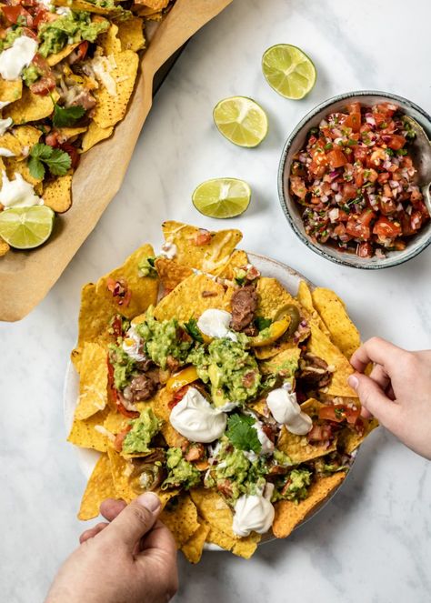 Vegetarian nachos are a firm family favourite and these loaded veggie nachos are always a winner! Big on flavour, so easy to make and perfect for movie night. #veggienachos #nachos Nachos Plating Ideas, Nachos Plating, Nachos Street Food, Nachos Vegetarian, Nachos Food Styling, Nacho Photography, Nachos Food Photography, Nachos Product Photography, Nachos Aesthetic