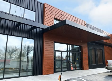 European Industrial Design, Metal Siding Commercial Building, Metal Building Commercial Design, Metal Building Retail Store, Woodgrain Metal Siding, Modern Commercial Building Exterior, Modern Warehouse Design Exterior, Commercial Metal Building, Modern Warehouse Design