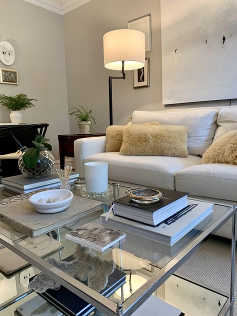 Glass coffee table, white sofa, plants & art White Couch Glass Coffee Table, Simple Elegant Living Room, Sofa And Two Chairs, White Leather Sofa, White Leather Sofas, Brown Leather Couch, White Couch, Plants Art, Cream Sofa